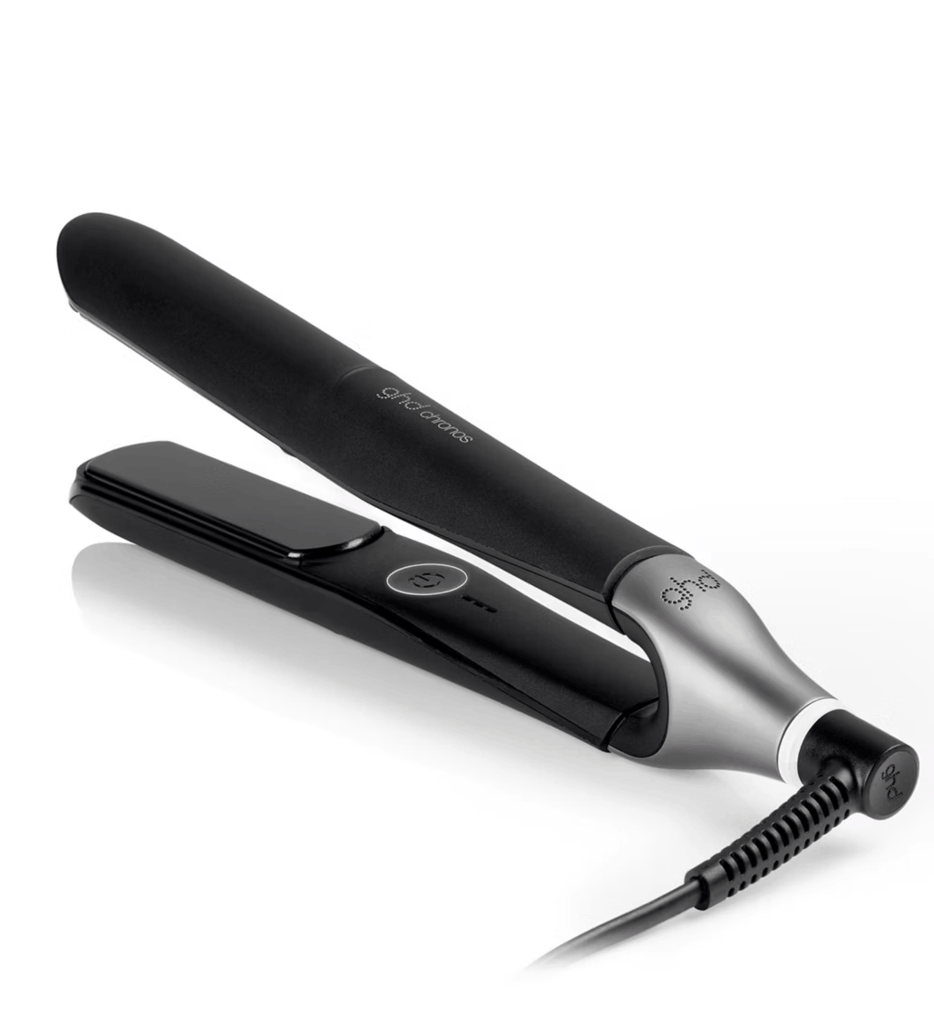 ghd Chronos hair straightener, black with silver hinge, open on a white background